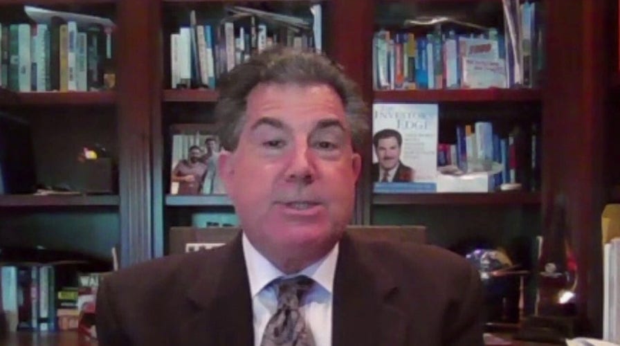 Dow plummets more than 940 points amid COVID surge, lockdown fears