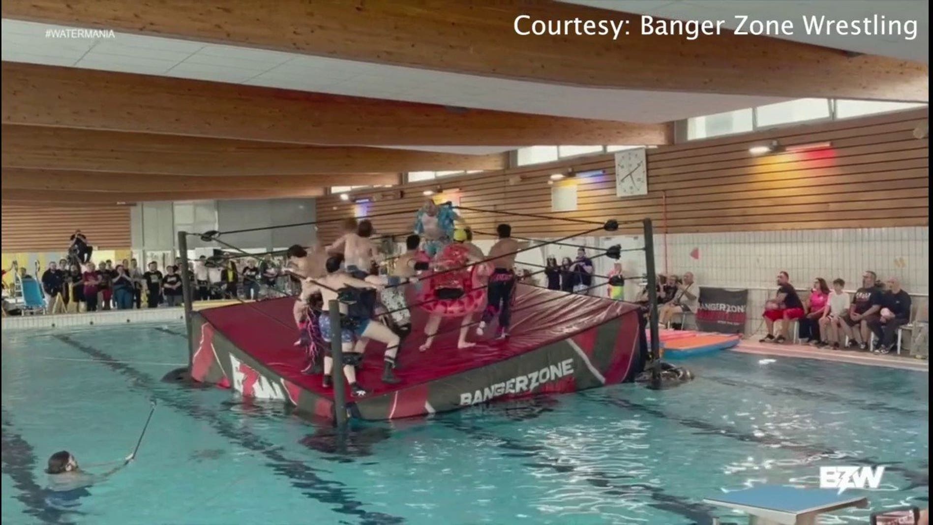 Pro wrestlers try to keep the ring afloat during a match