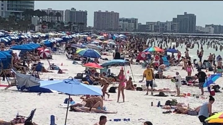 Spring breakers crowd Florida beach despite calls for social distancing