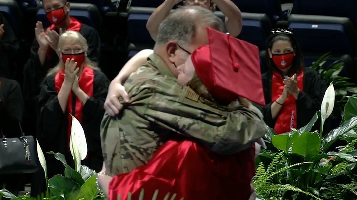 Military father surprises daughter at high school graduation