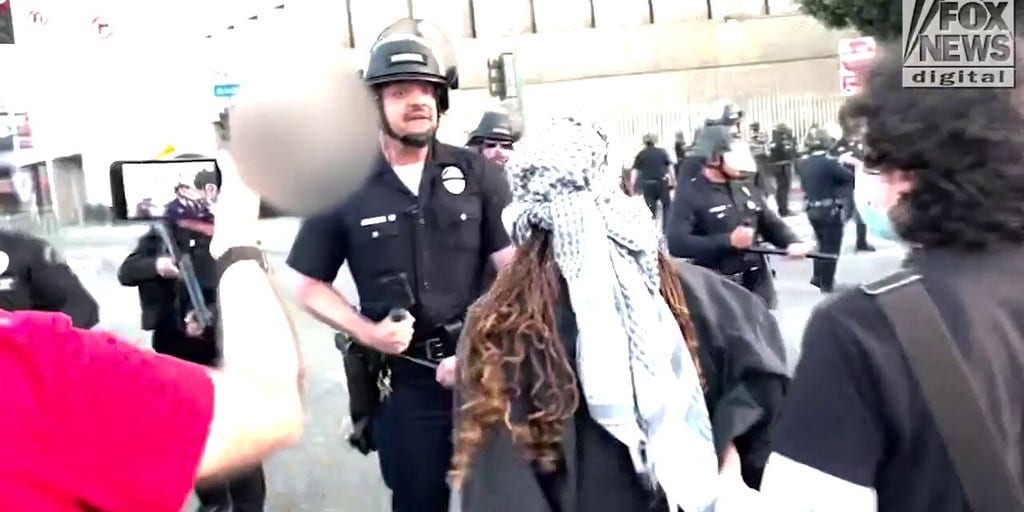 LAPD forces protesters back amid heated confrontation
