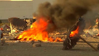 Angry locals tear down migrant camp in Ceuta