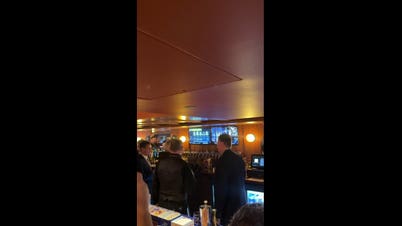 Priest blesses beer taps with holy water as beloved New York City bar finally returns home