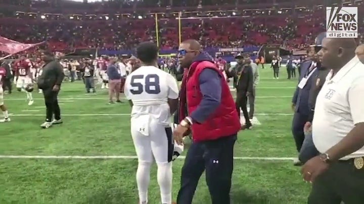 Deion Sanders walks off the field for the final time as Jackson State’s head coach