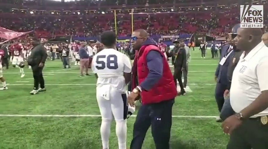 Deion Sanders walks off the field for the final time as Jackson State’s head coach