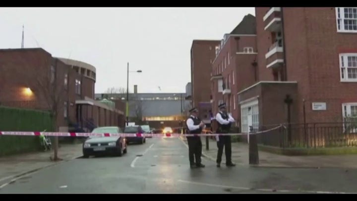 Metropolitan Police secure the scene after a drive by shooting wounded two children and four adults