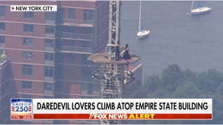 Daredevil couple arrested after scaling Empire State Building spire for proposal