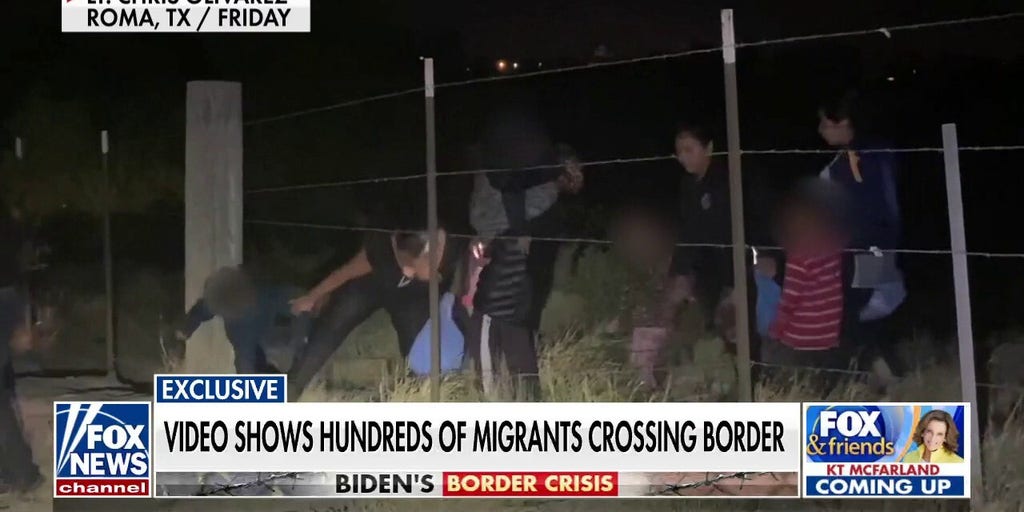 Exclusive Video Shows Hundreds Of Migrants Crossing Southern Border ...