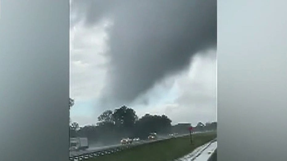 Tornado in Florida crosses highway, lifts portable building off tractor