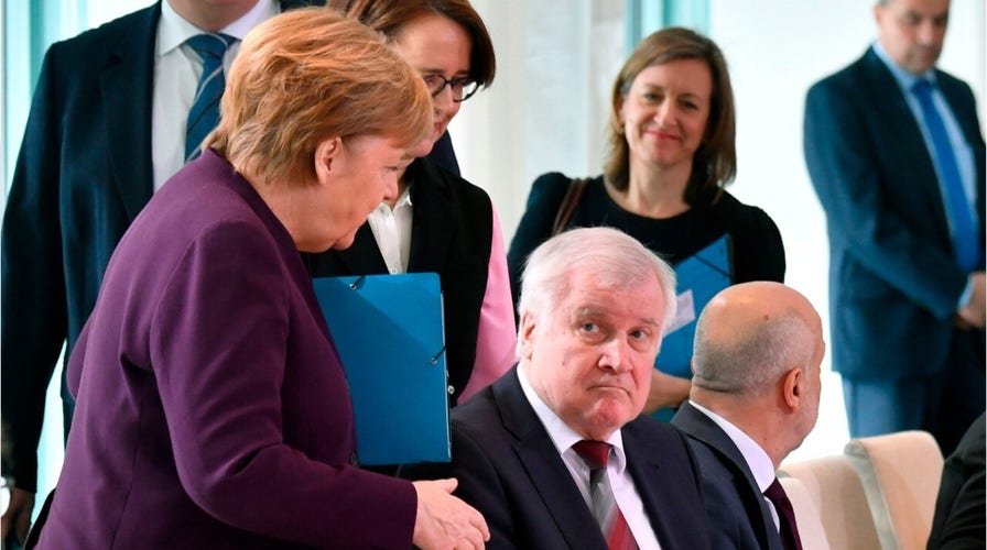 Angela Merkel rebuffed an attempted handshake with Germany interior minister