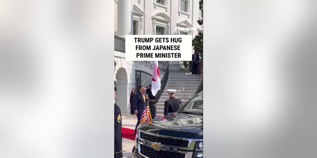 Trump hugs Japan's prime minister