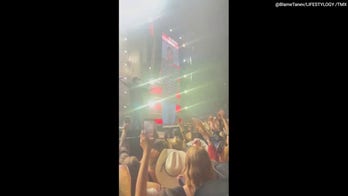 Luke Bryan slips and falls onstage