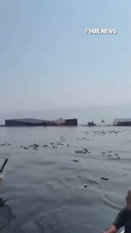 Containers FLOAT AT SEA after ship sinks near Strait of Hormuz