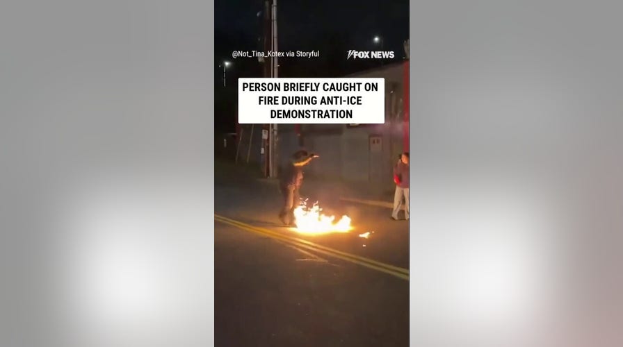 Person concisely  catches connected  FIRE during anti-ICE demonstration