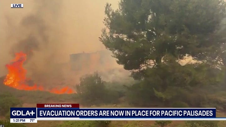Winds whip Southern California fire as it threatens structures, snarls traffic
