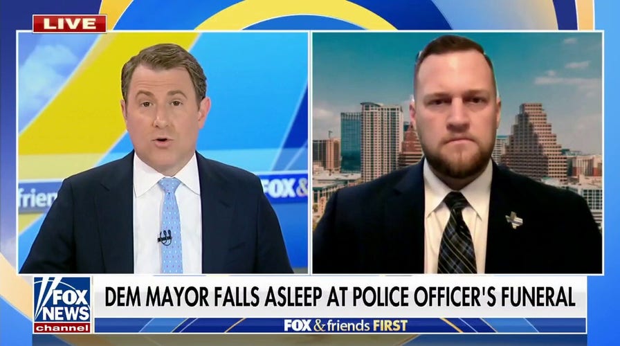 Democratic mayor slammed for falling asleep at police officer's funeral
