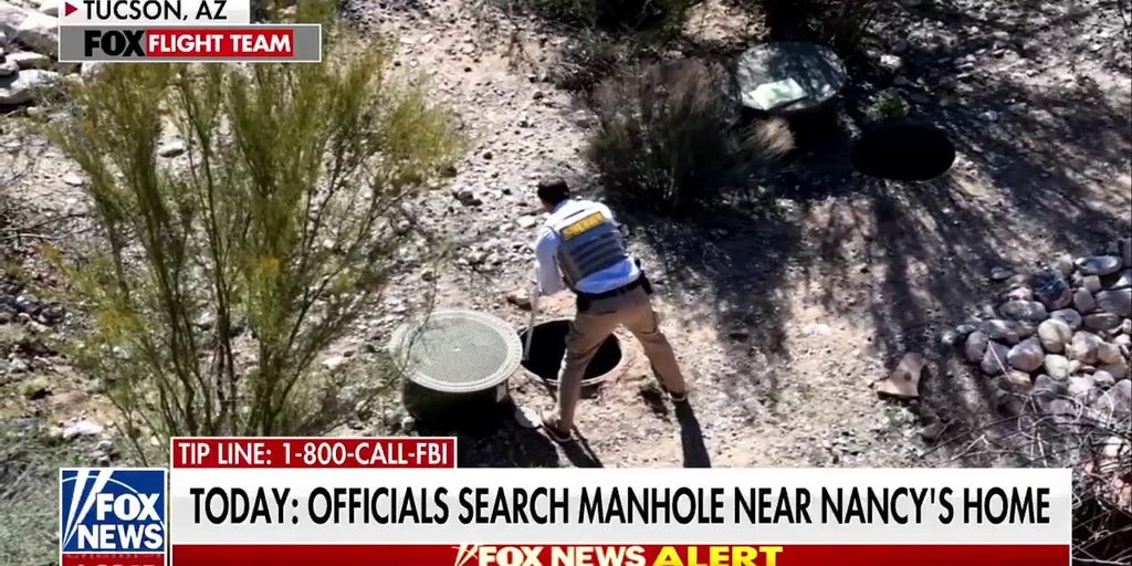 Investigators appeared to have been looking at manhole outside Nancy Guthrie's home