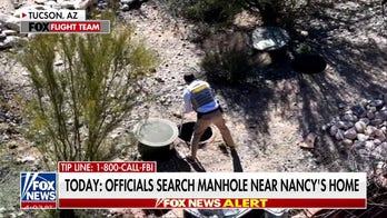 Investigators appeared to have been looking at manhole outside Nancy Guthrie's home