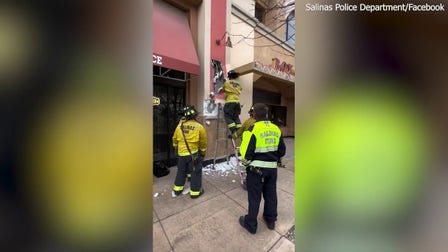 Firefighters cut through walls to rescue trapped burglary suspect