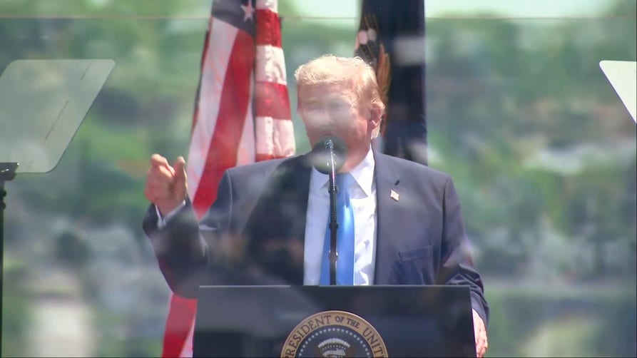Trump invites star Coast Guard athletes on stage during commencement speech