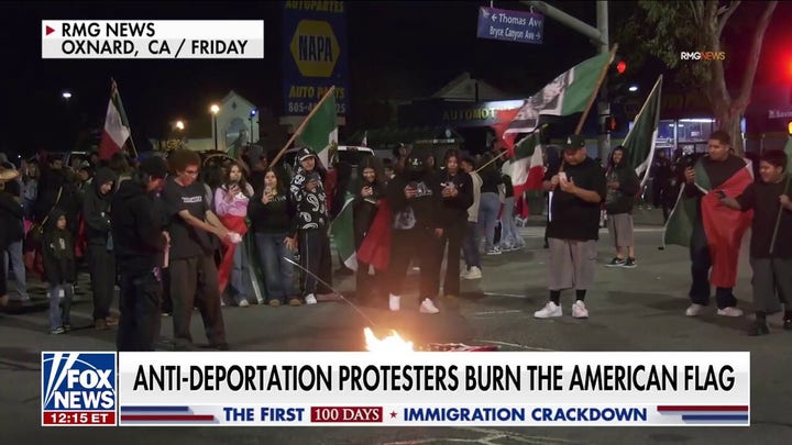 Anti-Trump protesters shut down LA freeway, burn the American flag