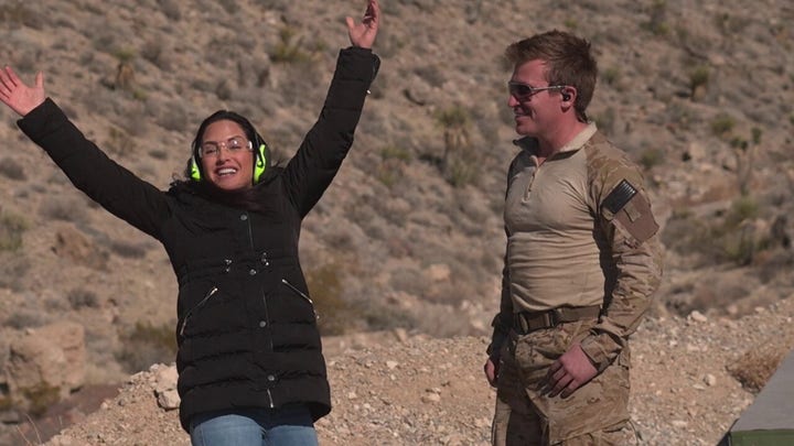 Emily Compagno fires a howitzer gun