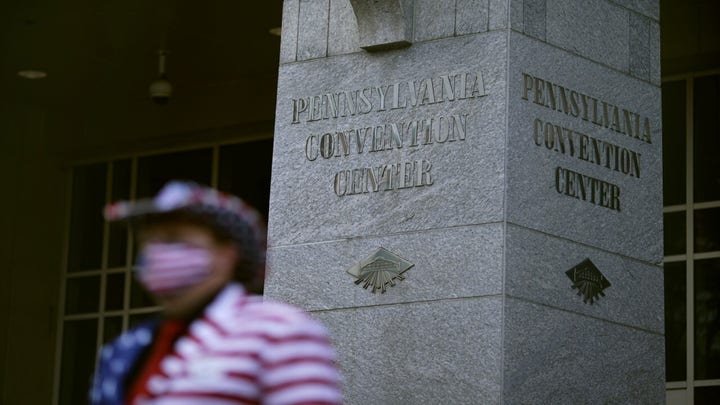 Two armed men arrested near Philadelphia vote-counting facility