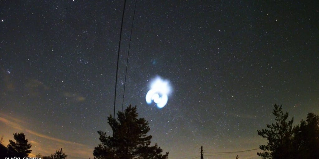 Spectacular blue spiral light from SpaceX rocket captured on video