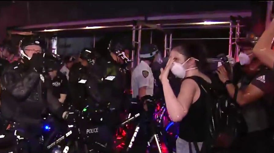 NYPD officers arrest protesters for defying citywide curfew