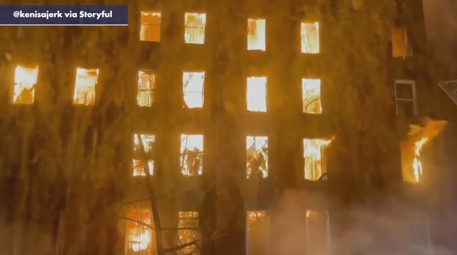Over 100 firefighters tackle New York building engulfed in flames 