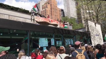 Fordham University anti-Israel protesters shout at NYPD, vandalize police bus