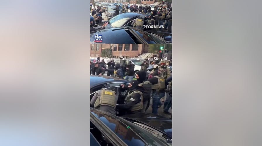 Federal agents forcefully remove a woman from her car amid anti-ICE protests