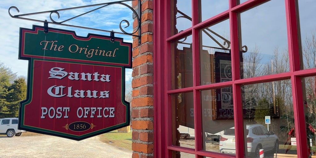 Santa Claus' elves in Christmas town write letters back to kids