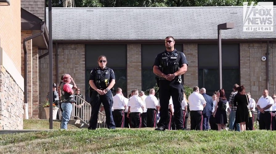Mourners attend Corey Comperatore's funeral in Cabot, Pennsylvania 