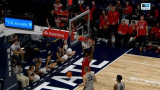 Darren Buchanan Jr gets up for a dunk, extending Rutgers' lead over Penn State