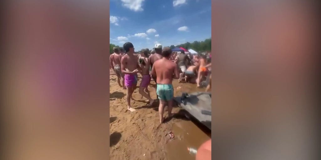 Chaotic sandbar fight spills into water during massive riverfront brawl