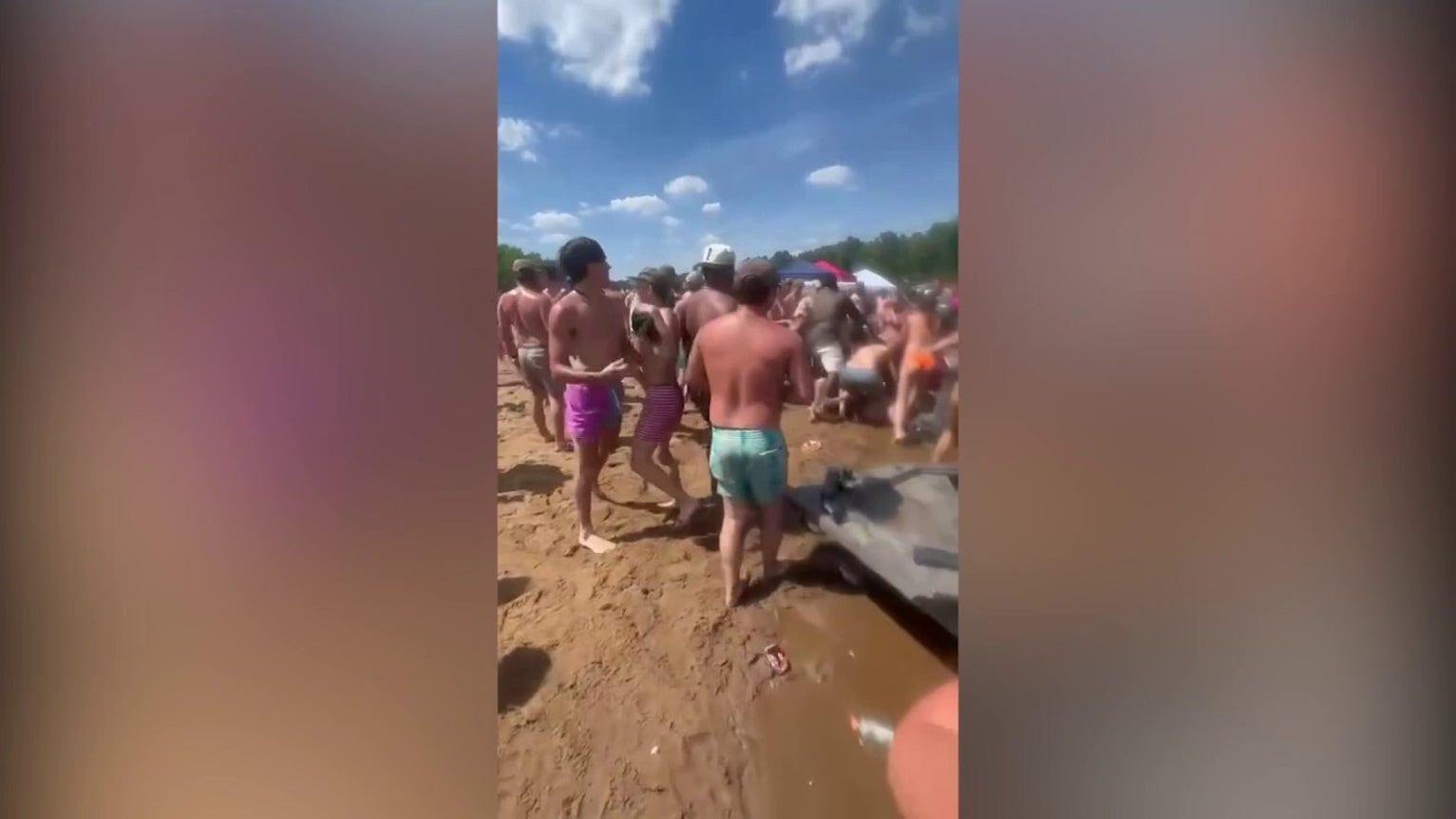 Chaotic sandbar fight spills into water during massive riverfront brawl