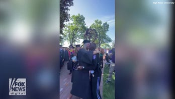 College campus security officer gives 'goodbye hugs' to graduating seniors