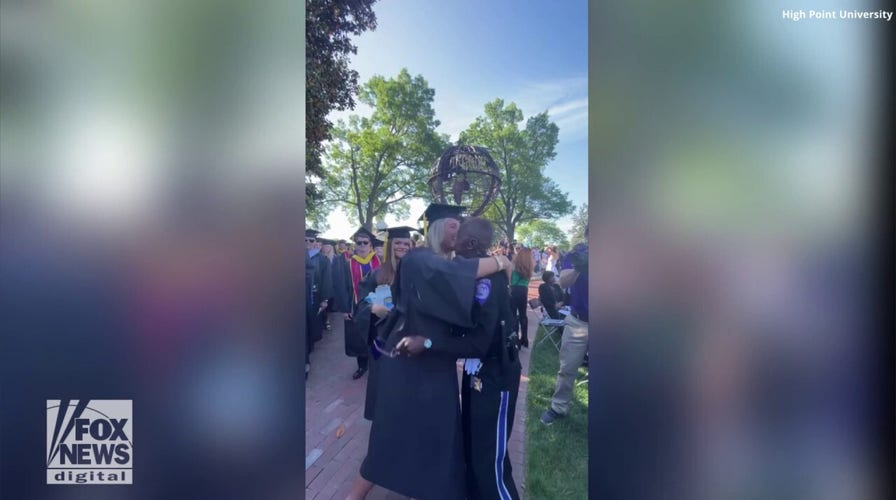 College campus security officer gives 'goodbye hugs' to graduating seniors