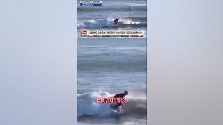 Hundreds of surfing Santas ride the waves in Cocoa Beach