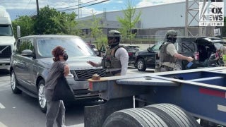 ICE clashes with agitators outside Delaney Hall