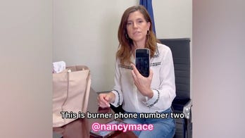 Congresswoman Nancy Mace shows off multiple cellphones, iPads in her bag