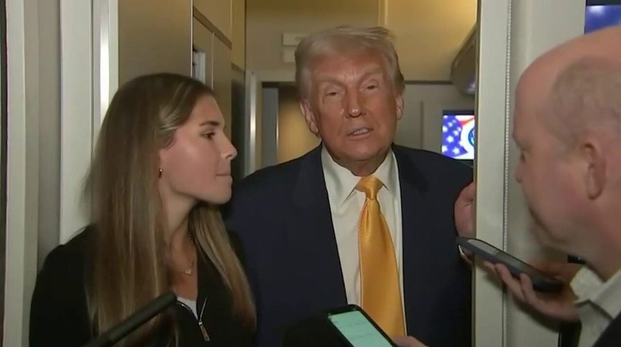 Trump, granddaughter gaggle with reporters on Air Force One after UFC fight