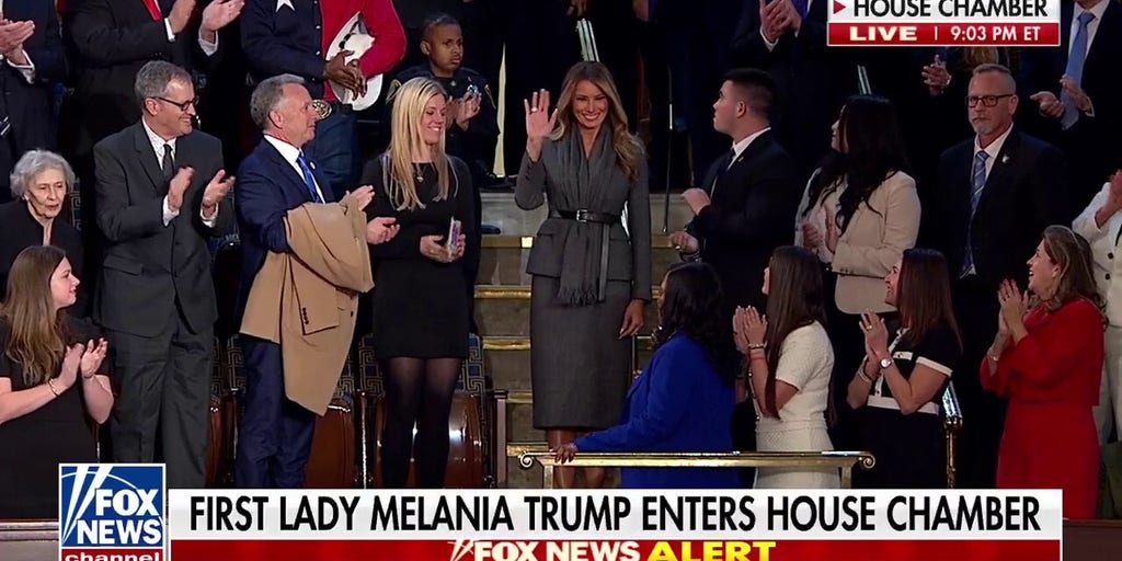 First lady Melania Trump enters House Chamber to standing ovation