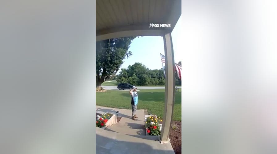 Amazon driver stops delivery to salute American flag