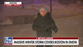 Boston authorities warn residents to stay off roads during snow storm