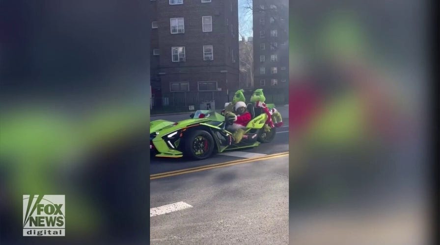 NYC Grinch car drives through Manhattan to celebrate Christmas