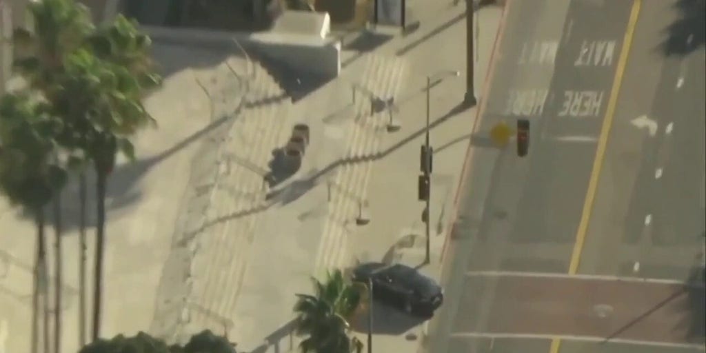 LA City Hall evacuated after incident involving car driving onto sidewalk in front of building