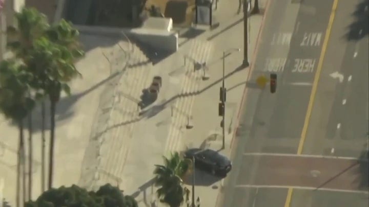 LA City Hall evacuated after incident involving car traveling onto sidewalk in front of building