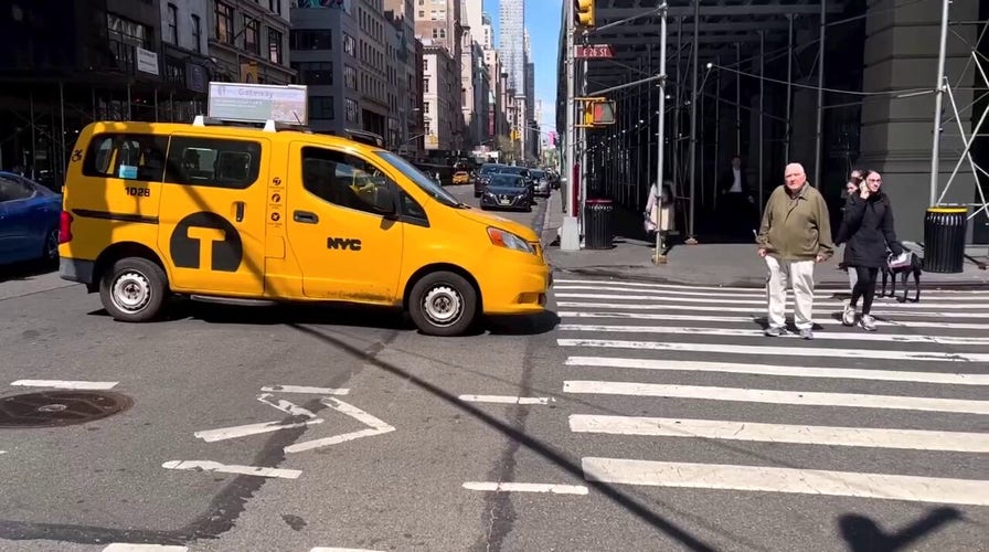 Elderly man blocks NYC taxi in middle of busy intersection for allegedly running red light